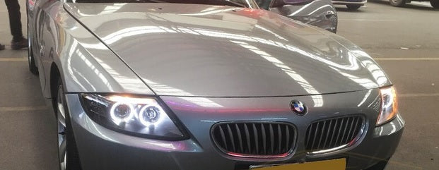 BMW Z4 E85 2003-2009 FARI ANTERIORI NERI ANGEL EYES LENTICOLARI H1 / H7 AUTOELEGANCERICAMBI