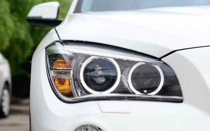 Fari LED Angel Eyes adatti per BMW X1 E84 (2009-2012) Xenon Look