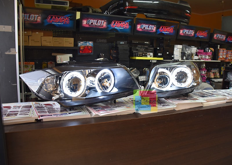 Coppia fari adatti per bmw e90 e91 angel eyes led bianchi con freccia led