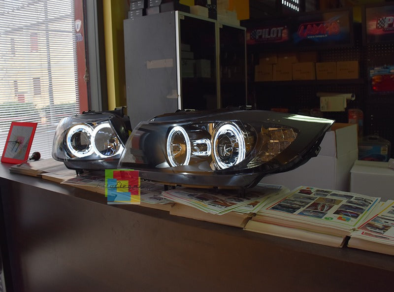 Coppia fari adatti per bmw e90 e91 angel eyes led bianchi con freccia led