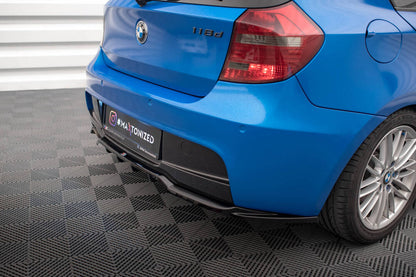 SPLITTER POSTERIORE CENTRALE (CON BARRE VERTICALI) ADATTO PER BMW 1 M-PACK E87 FACELIFT