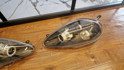 ART.2159 FARI ANTERIORI FIAT GRANDE PUNTO 2005-2008 NERI ANGEL EYES