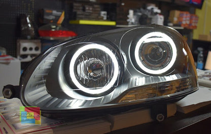ART. 0377 FARI ANTERIORI VW GOLF 5 NERI ANGEL EYES