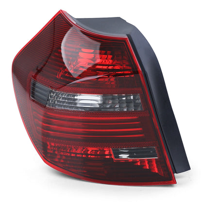 Fanale posteriore a LED nero fumè sinistro TYC adatto per BMW E81 E87