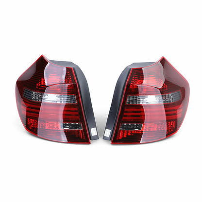 Coppia fanali posteriori fumé neri TYC adatti per BMW E81 E87 07-12 AUTOELEGANCERICAMBI