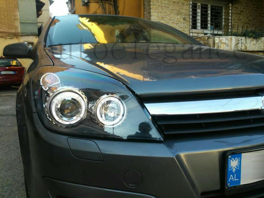 OPEL ASTRA H 2004-2007 FARI NERI CON ANELLI ANGEL EYES LED BIANCHI