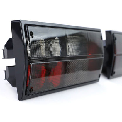 Coppia fanali posteriori nero fumè per VW Bus Box Transporter T3 79-92 AUTOELEGANCERICAMBI