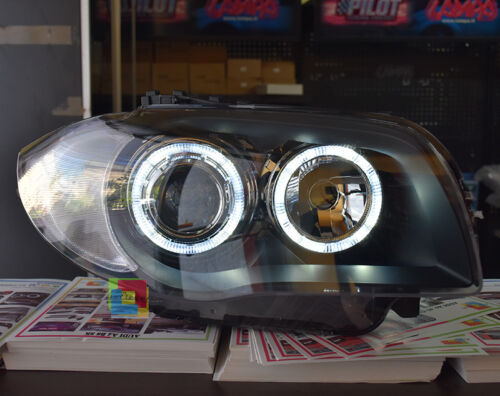 BMW SERIE 1 E81 E82 E87 E88 04-11 FARI NERI CON ANELLI ANGEL EYES LED BIANCHI AUTOELEGANCERICAMBI