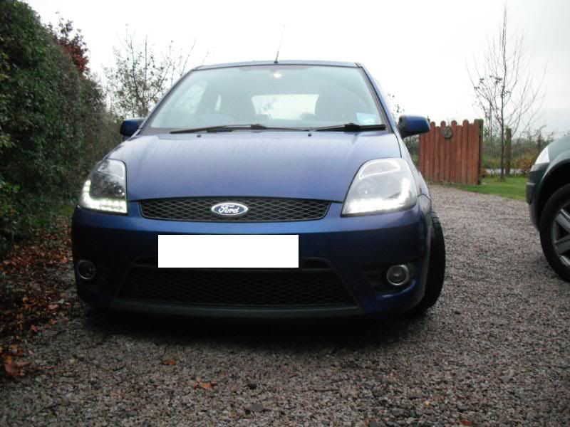 FORD FIESTA MK6 2002-2005 DRL LED POSITION HEADLIGHTS BLACK LENTICULAR HEADLIGHTS