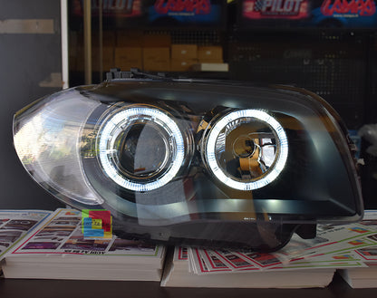 BMW SERIE 1 E81 E82 E87 E88 04-11 FARI NERI CON ANELLI ANGEL EYES LED BIANCHI AUTOELEGANCERICAMBI