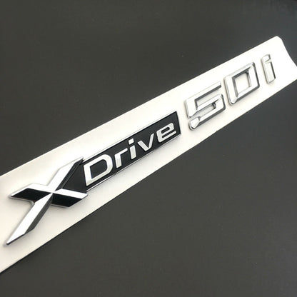 BMW X3 F25 2010 IN POI 1x LOGO X DRIVE 2.0 DECORATIVO CROMATO E NERO ADESIVO AUTOELEGANCERICAMBI