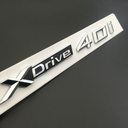 BMW X3 F25 2010 IN POI 1x LOGO X DRIVE 2.0 DECORATIVO CROMATO E NERO ADESIVO AUTOELEGANCERICAMBI