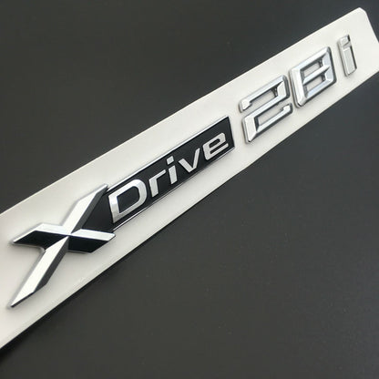 BMW X3 F25 2010 IN POI 1x LOGO X DRIVE 2.0 DECORATIVO CROMATO E NERO ADESIVO AUTOELEGANCERICAMBI