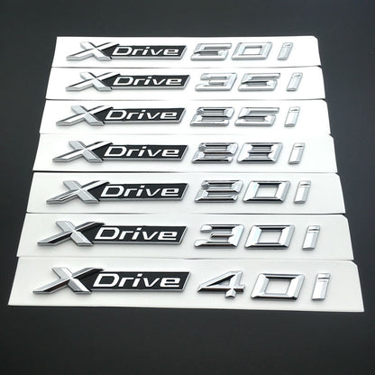 BMW X3 F25 2010 IN POI 1x LOGO X DRIVE 2.0 DECORATIVO CROMATO E NERO ADESIVO AUTOELEGANCERICAMBI