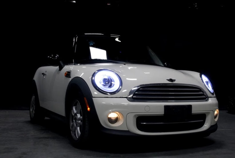 MINI COOPER R56 2006-2010 FARI ANTERIORI NERI ANGEL EYES D1S XENON DI SERIE