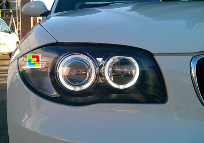 BMW SERIE 1 E81 E82 E87 E88 04-11 FARI NERI CON ANELLI ANGEL EYES LED BIANCHI AUTOELEGANCERICAMBI