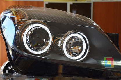 OPEL ASTRA H 2004-2007 FARI NERI CON ANELLI ANGEL EYES LED BIANCHI