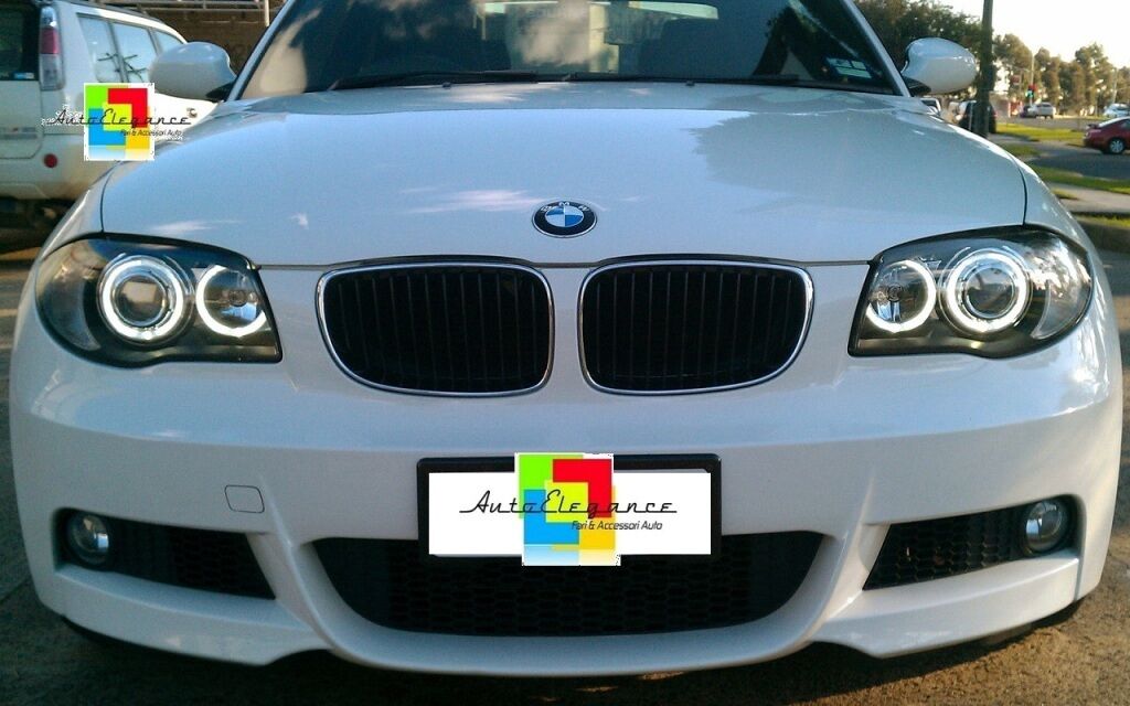 BMW SERIE 1 E81 E82 E87 E88 04-11 FARI NERI CON ANELLI ANGEL EYES LED BIANCHI AUTOELEGANCERICAMBI