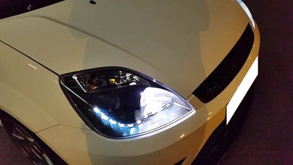 FORD FIESTA MK6 2002-2005 DRL LED POSITION HEADLIGHTS BLACK LENTICULAR HEADLIGHTS