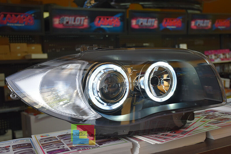 FARI NERI CON ANELLI ANGEL EYES BMW SERIE 1 E81 E82 E87 E88 04-11 LED BIANCHI -.